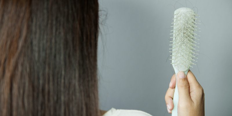 Hairbrush with hairs on it